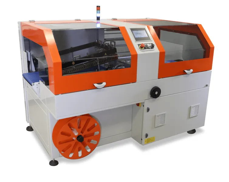 An orange and white enclosed automatic L-bar sealer with a touchscreen, guarded seal area, and film unwind at the front.