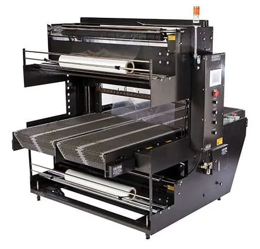 An Eastey sleeve wrapper with an upper and lower film roll and a roller conveyor.