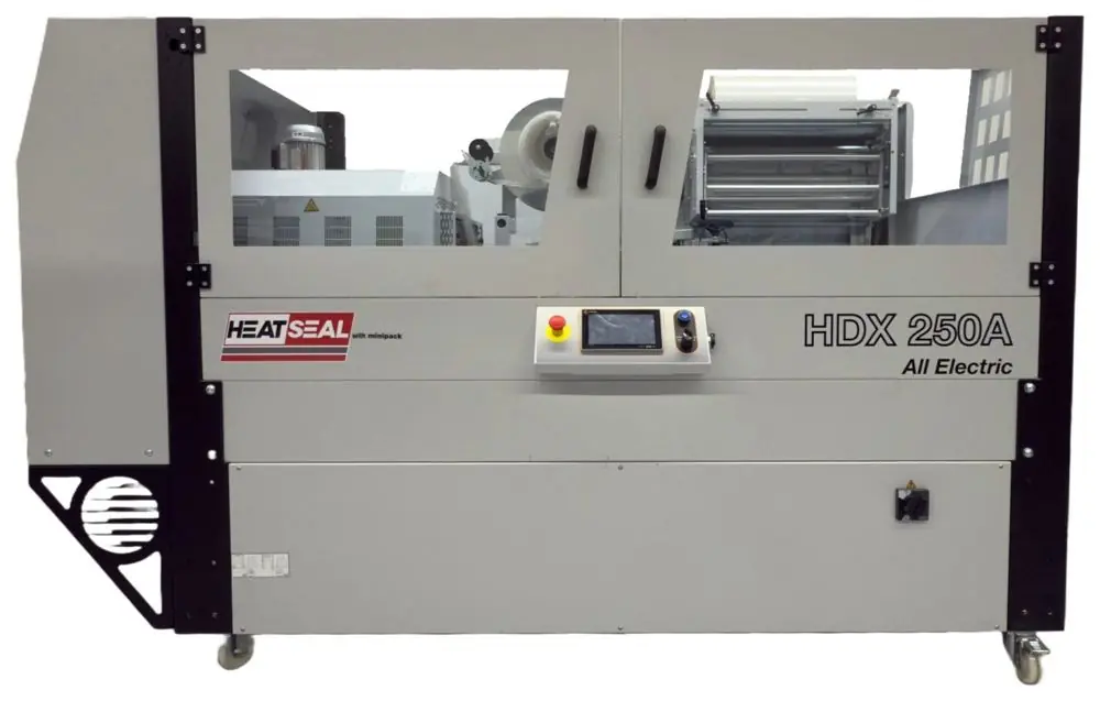 A Heat Seal HDX 250A enclosed machine combining an automatic L-sealer and shrink tunnel in one cabinet.